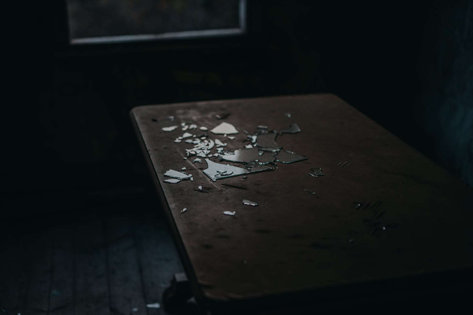 shards of broken glass on table